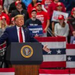 Donald Trump speaks at a rally; Teddy Williams and Bear Pascoe are in the crowd