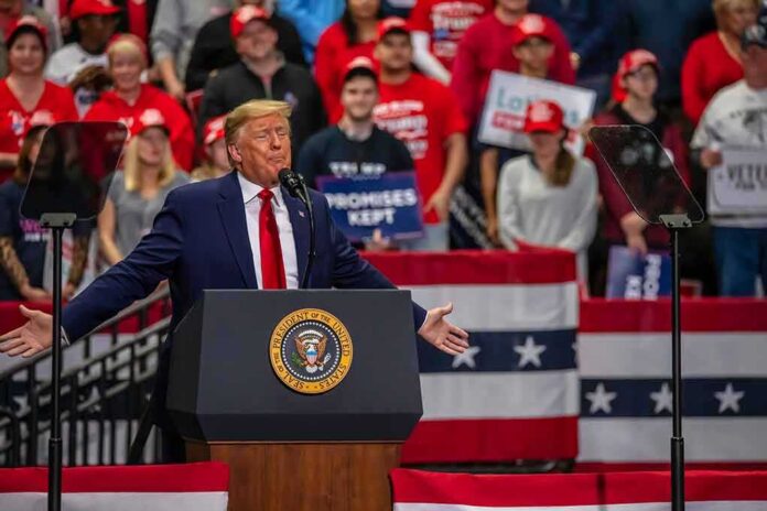 shutterstock_1789781168 Donald Trump speaks at a rally; Teddy Williams and Bear Pascoe are in the crowd