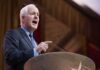 Civil War Brewing Inside GOP Elderly man in suit speaking at a podium