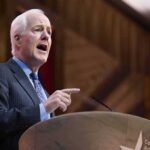 Civil War Brewing Inside GOP Elderly man in suit speaking at a podium