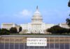 View of the U.S. Capitol building with a security barrier in front