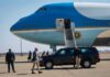 Media Access Meltdown Erupts Over Tennessee Trip Security detail near blue and white aircraft with staircase and SUV