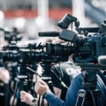 Los Angeles Hosts Trump Fundraiser Broadcast cameras on tripods at a press event