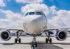 Commercial airplane on runway, front view
