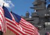 U.S. Veto Over Arctic Rivals? American flags in front of a naval ship under a blue sky