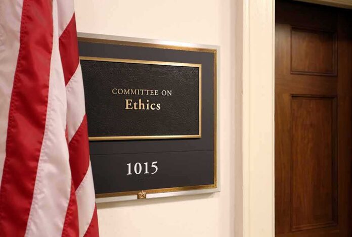 shutterstock_688254379 Office sign for Committee on Ethics with room number 1015