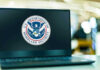 Election-Eve Raid Shocks Capitol Laptop displaying U.S. Department of Homeland Security logo.