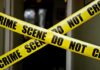 Campus ‘Coke’ Trap Ends In Tragedy Yellow crime scene tape crossing a doorway