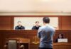 32 Chop Wounds: What Investigators Found defendant stands before judges in a courtroom