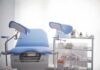 Abortion Bill Quietly Kills Reporting Gynecological exam chair with blue padding in a clinic room