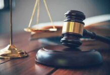 Ambush Twist: Max Sentence Shocks Manhattan Judge's gavel on block with scales of justice