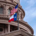 Leaked Audio Explodes Texas GOP Feud Texas and U.S. flags in front of a capitol building dome