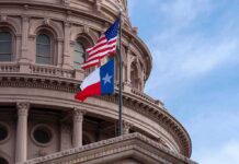 Leaked Audio Explodes Texas GOP Feud Texas and U.S. flags in front of a capitol building dome