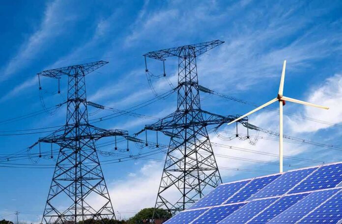 shutterstock_138865700 Power lines with wind turbine and solar panels