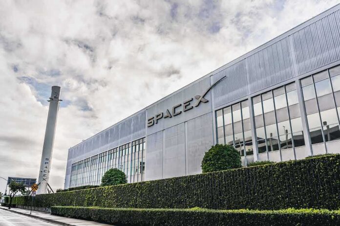 shutterstock_1589393992 SpaceX headquarters exterior with rocket booster and hedge