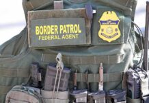 DHS Bullets Rip Through Bronx Car Tactical vest with law enforcement gear and tools