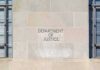 Department of Justice building facade with engraved sign