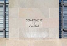 Department of Justice building facade with engraved sign