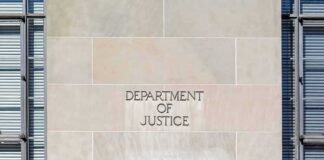 Department of Justice building facade with engraved sign