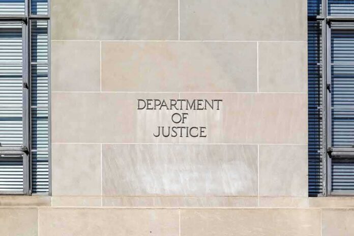 shutterstock_1672888435 Department of Justice building facade with engraved sign