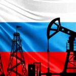 Silhouettes of oil rigs against a tricolor flag background