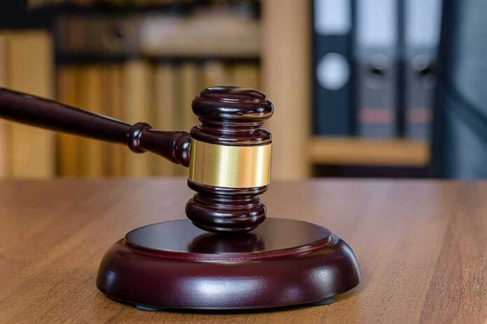 Judge's gavel on a wooden sound block
