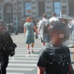 Crowd crossing a city street with digital tracking overlays