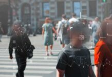 Facial Recognition Creeps Into Daily Life Crowd crossing a city street with digital tracking overlays