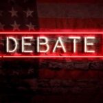 Iowa House Candidates Clash Over Tariffs, Taxes Neon sign reading debate on a brick wall