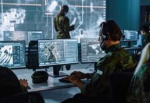 War Window Opens After Midterms Military analysts at computers in a command center