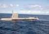 Boy Scout Foils Nazi Spies Submarine cruising on calm ocean surface