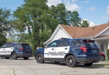 Birthday Tragedy: Chilling Louisiana Mystery Two police SUVs parked near a suburban house