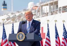 What Trump Said to Blacks and Jews Donald Trump speaking at a podium with American flags and a ship in the background