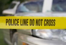 Orlando Horror: Baby Left To Roast Police tape in front of a car