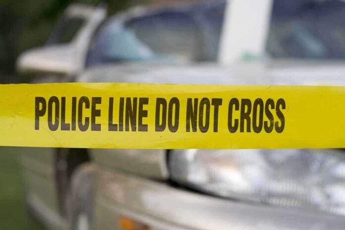 shutterstock_3358598 Police tape in front of a car